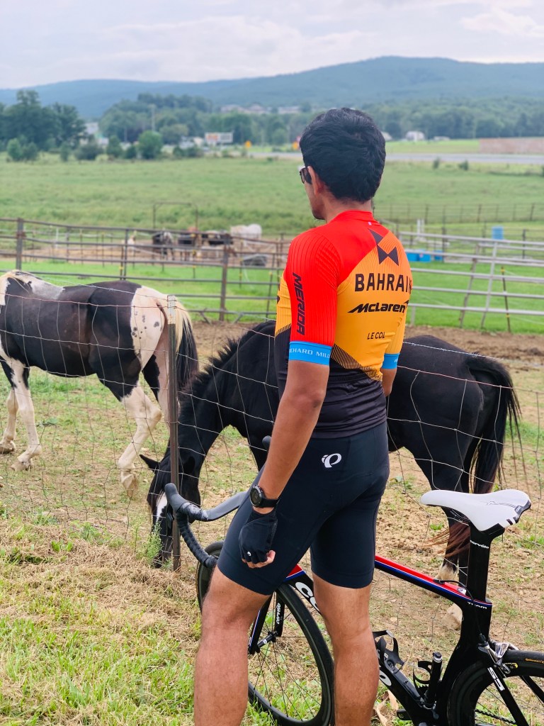 Yeswanth beside his bicycle during a countryside stop